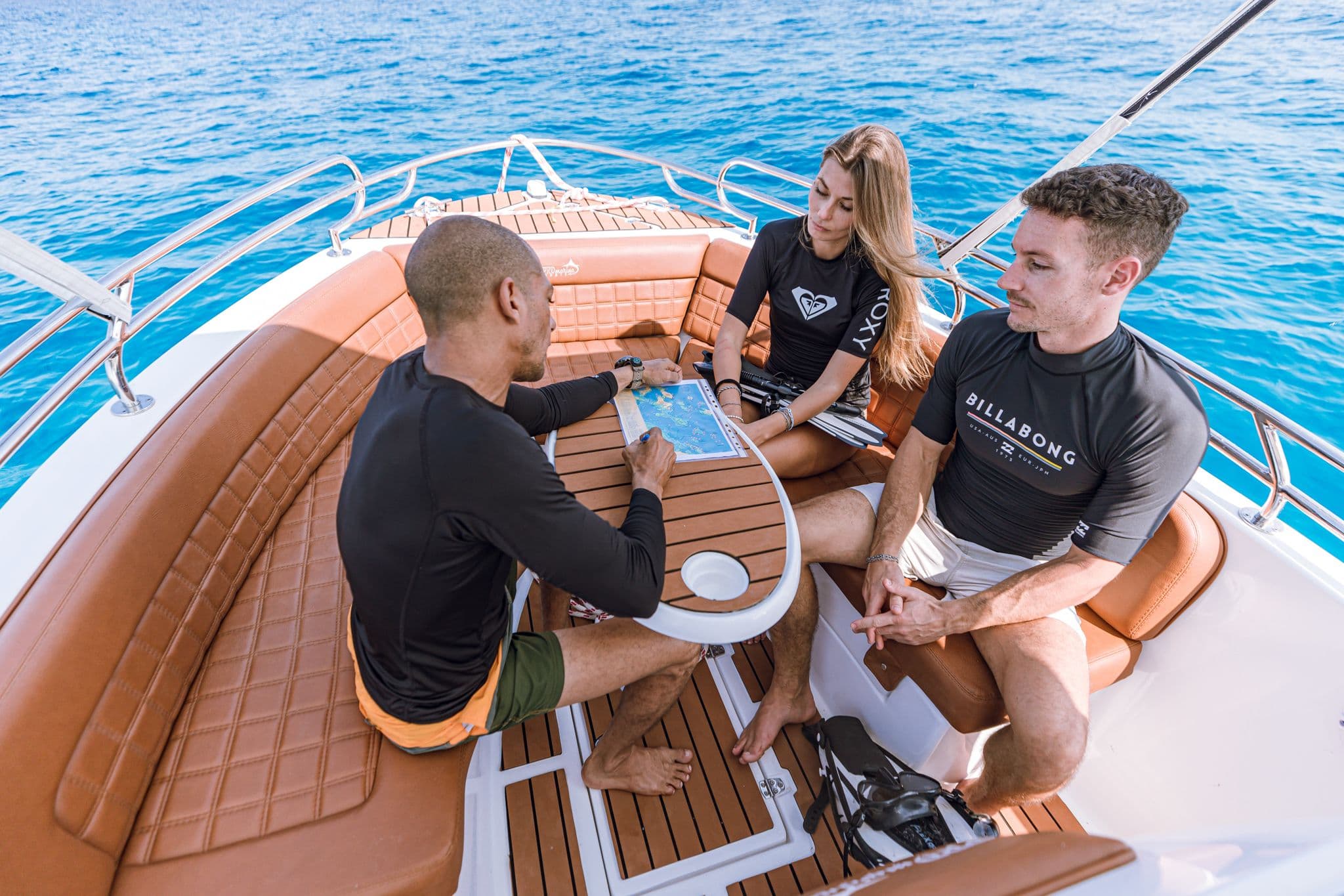 Guests relaxing around the table on a private speedboat trip