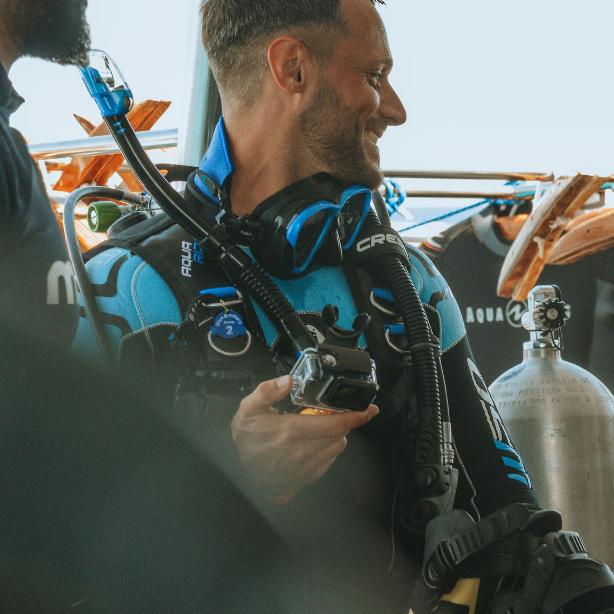 Advanced Open Water diver preparing equipment on the boat