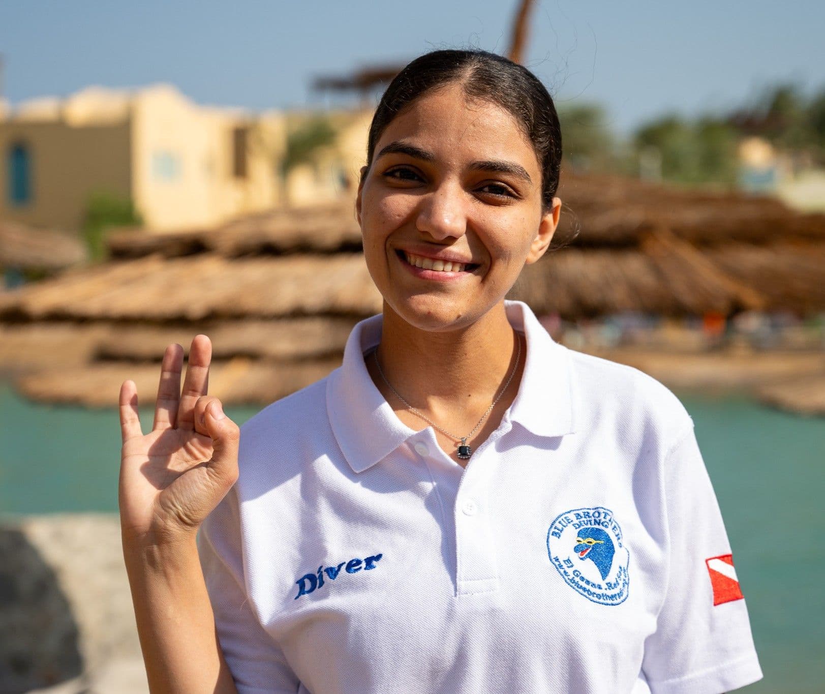 Iman from the Blue Brothers Diving team making an OK sign