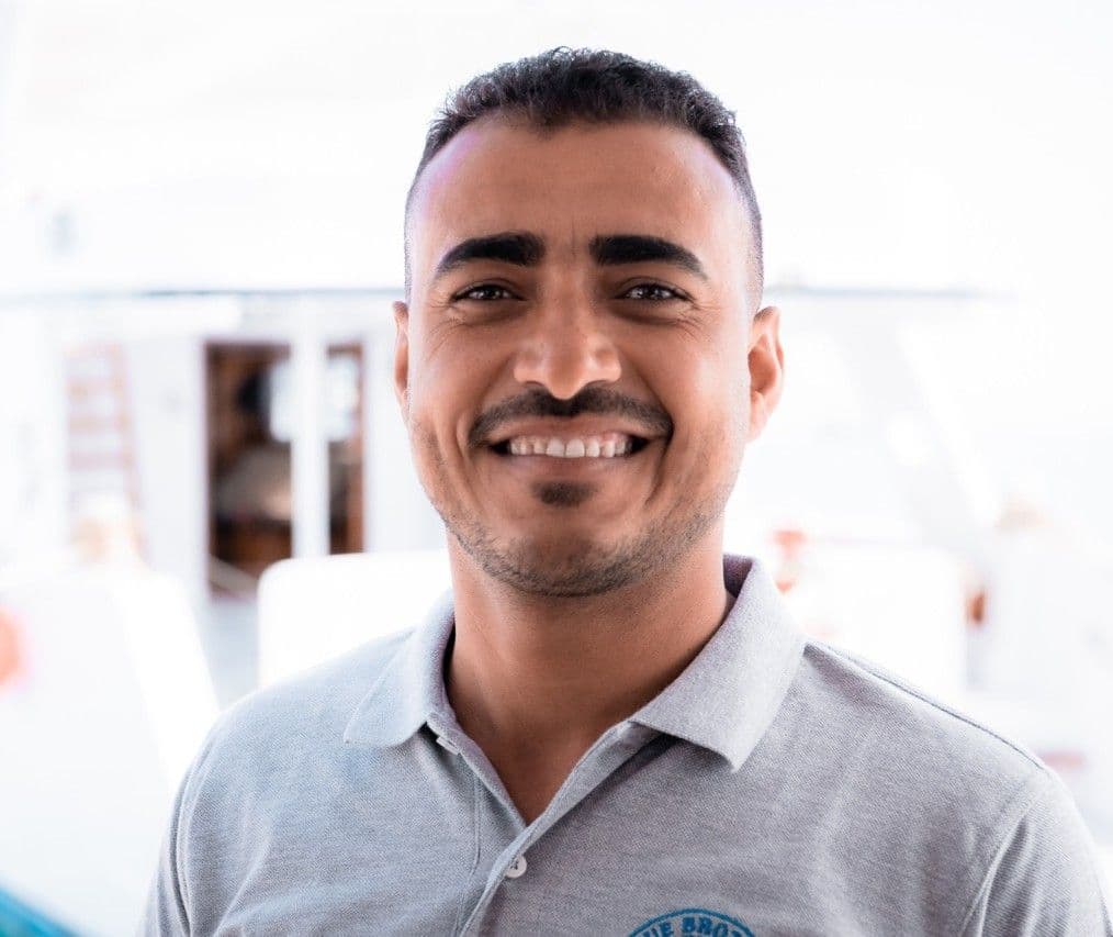 Osama from the Blue Brothers Diving team smiling outdoors