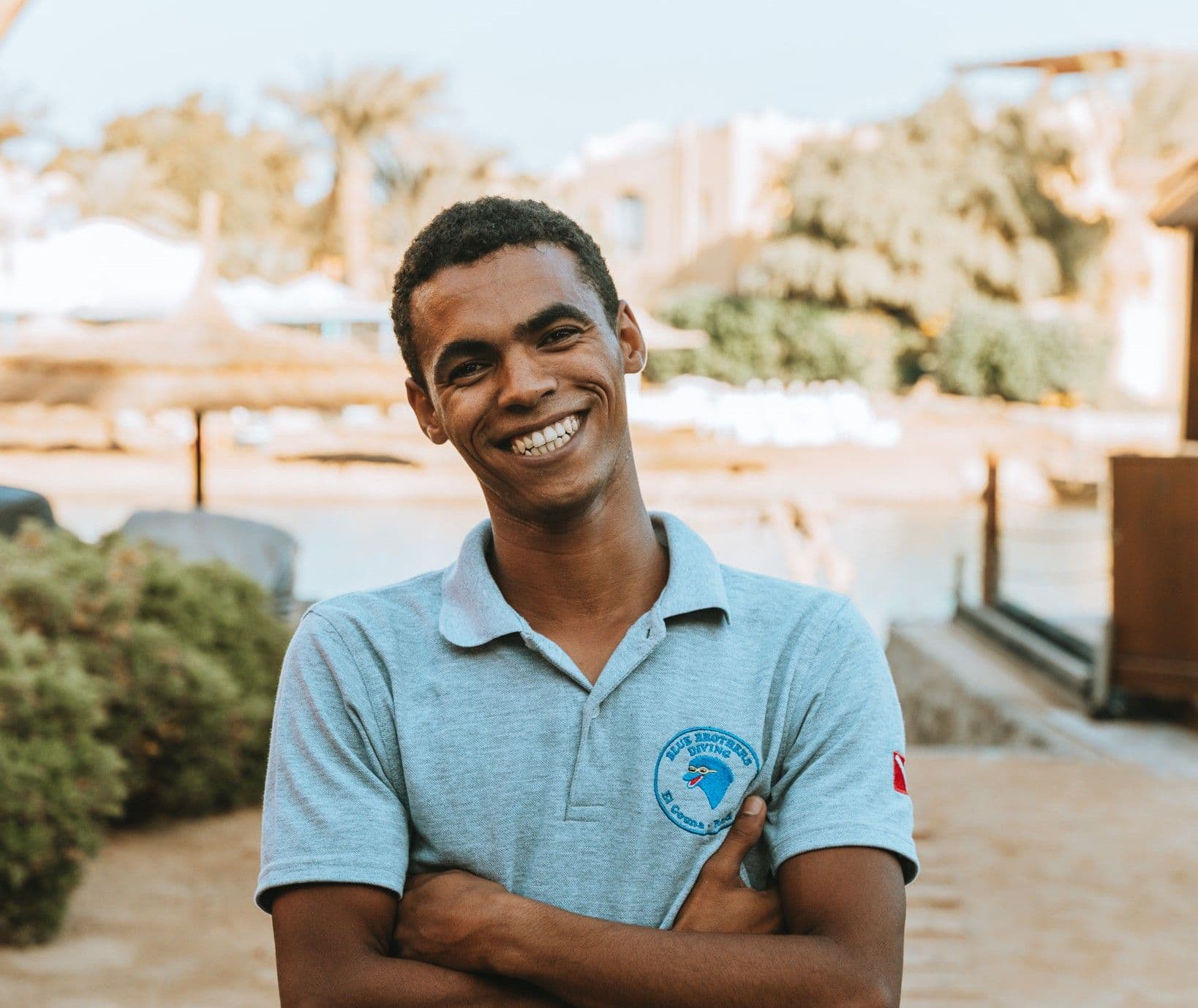 Shaban from the Blue Brothers Diving team smiling at the resort