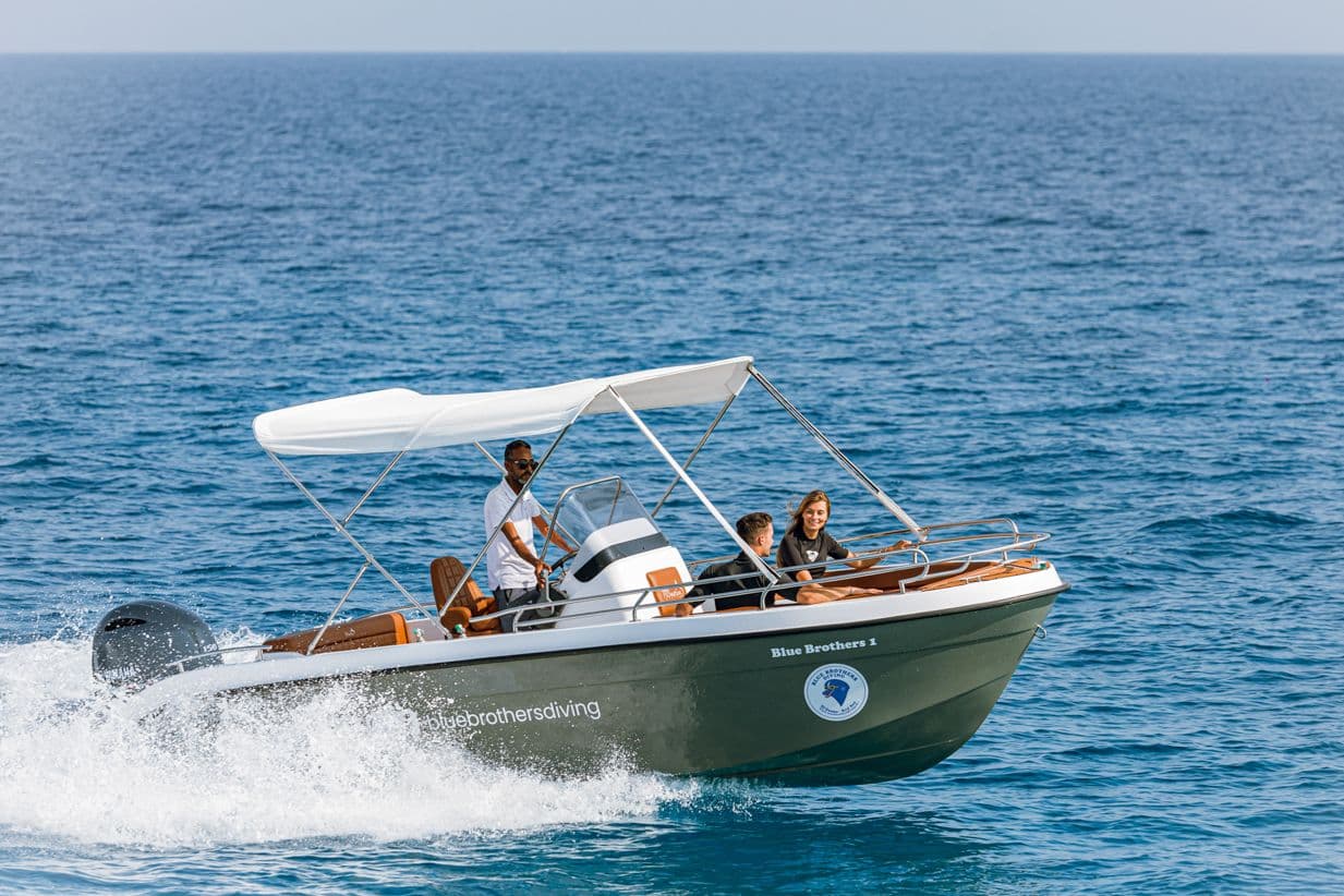 Family riding in a small motorboat on the Red Sea near El Gouna