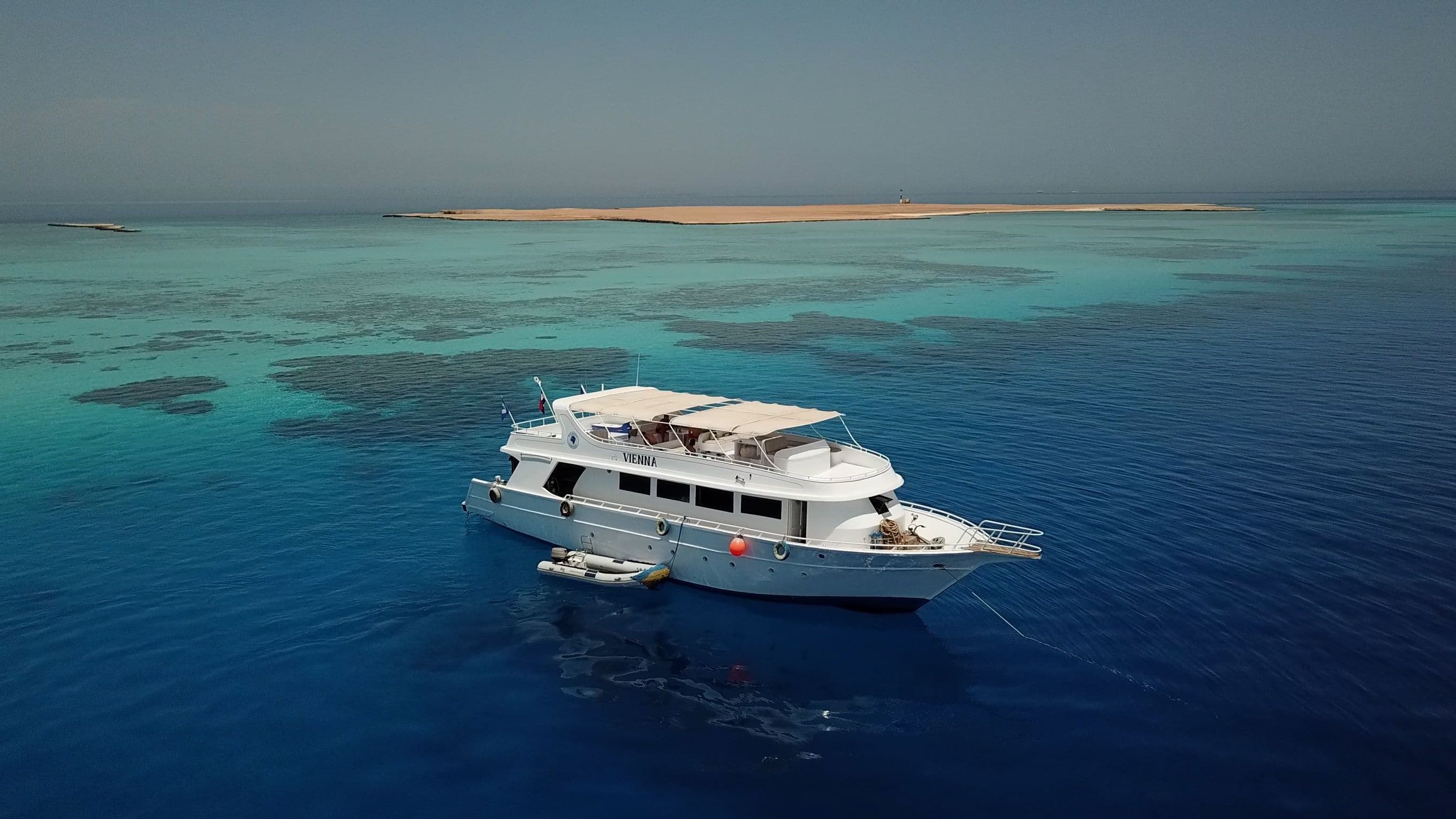 Blue Brothers day boat anchored in turquoise Red Sea water near El Gouna