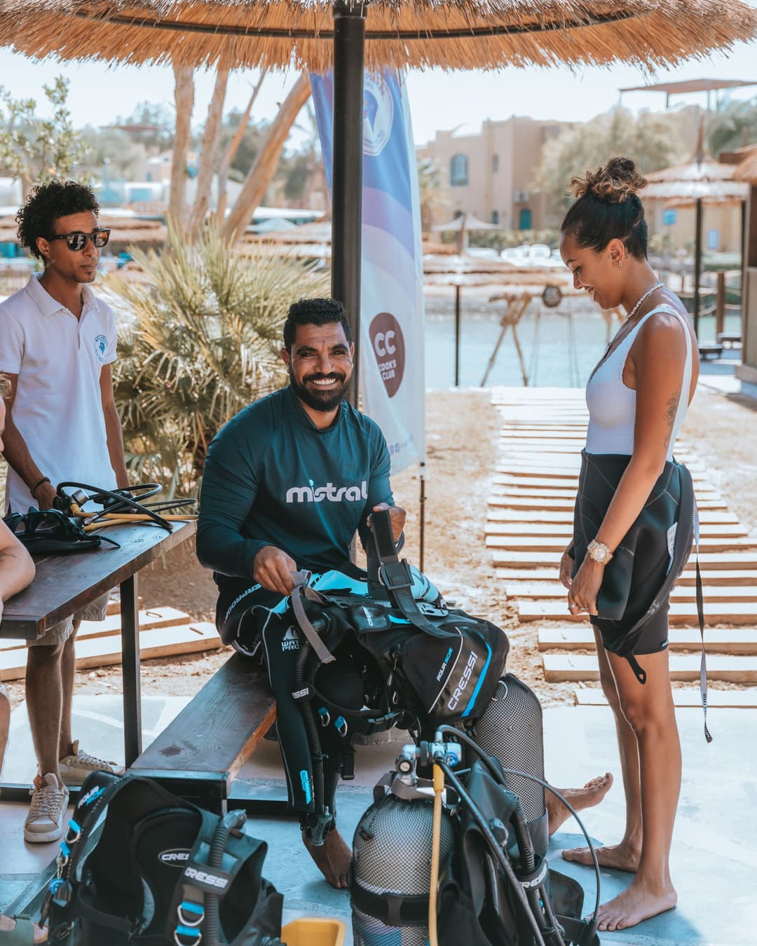 Divemaster trainee assembling dive gear at the base