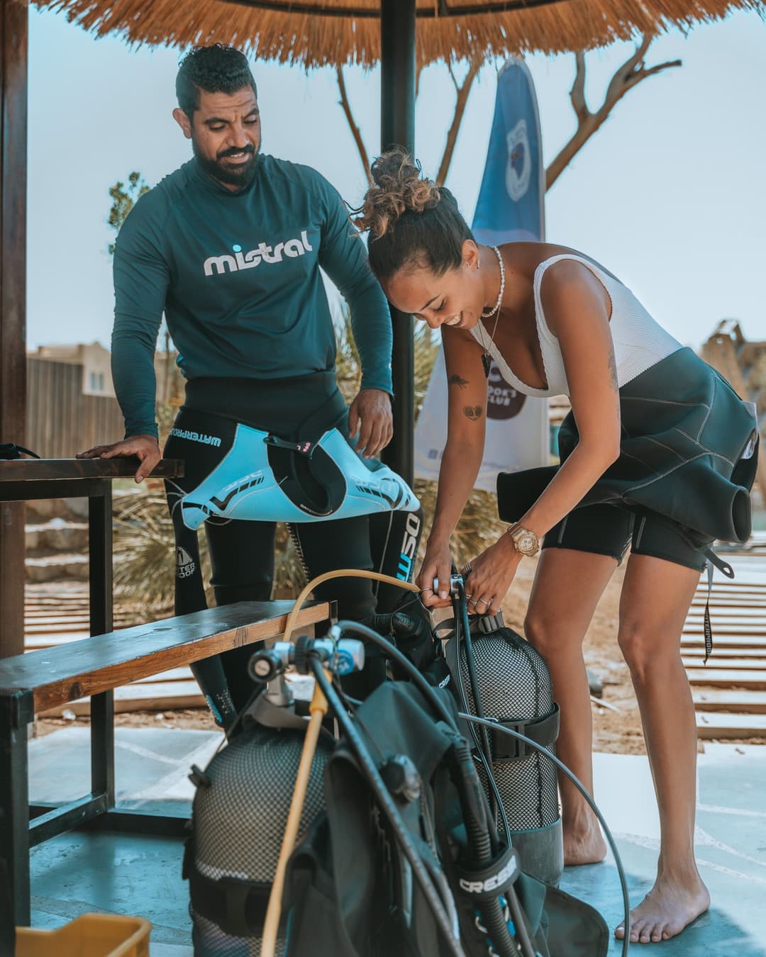 Open Water Diver students assembling scuba equipment at the dive center