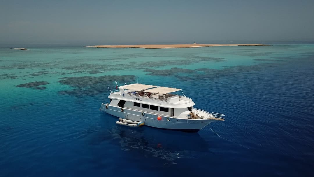 Blue Brothers day boat anchored in turquoise Red Sea water